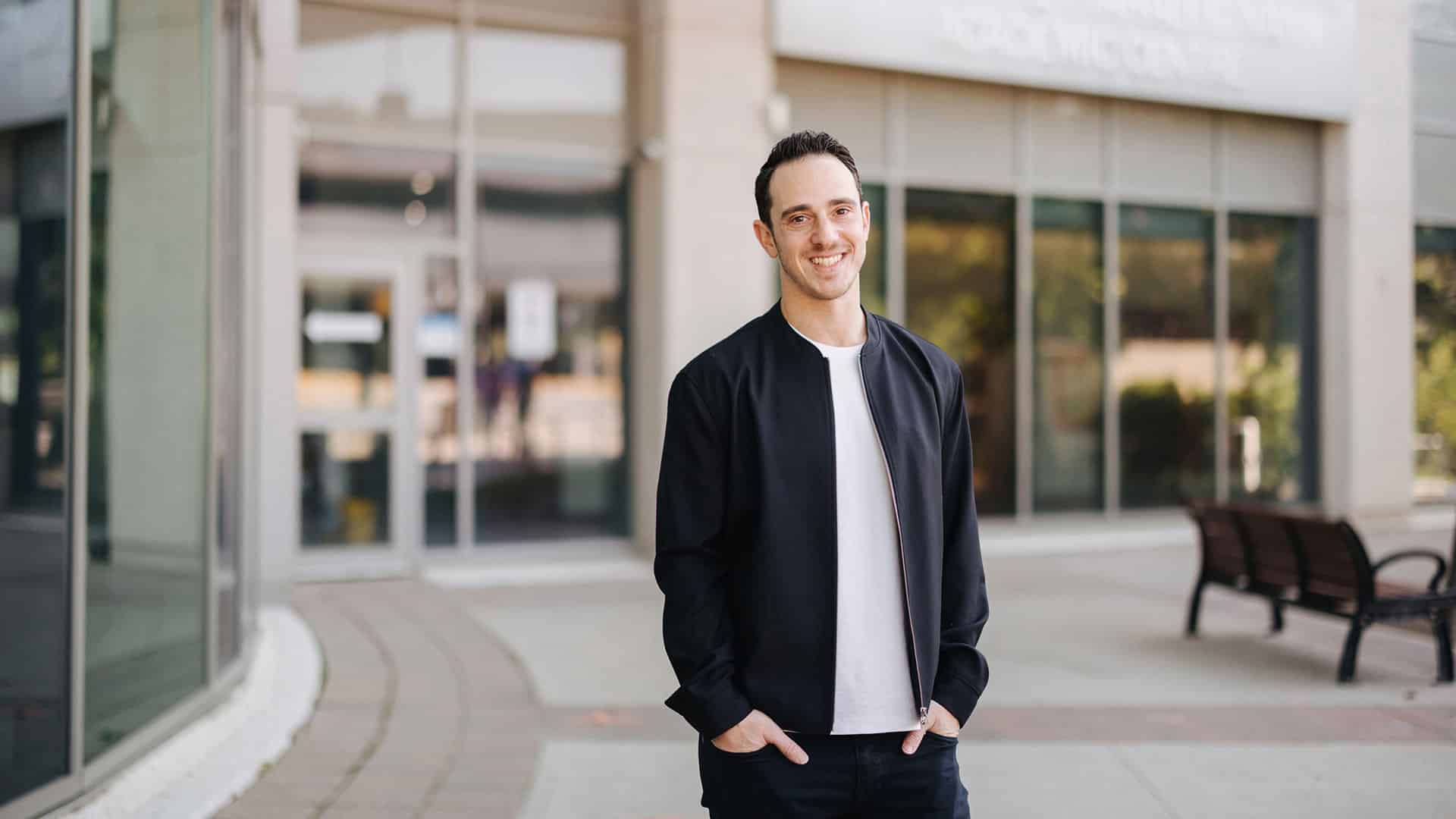Daniel Goldgut, co-founder of Epilogue, standing at the entrance of NYG